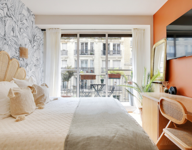 View of a chic and orange Colivys bedroom in Paris